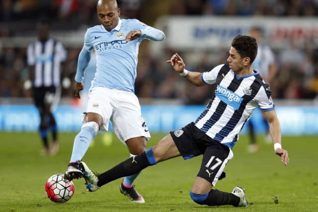 Newcastle United's Ayoze Perez and Manchester City's Fernandinho (left) battle for the ball