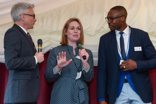 Jonathan Edwards speaks to head of Newcastle United Foundation Kate Bradley and Shola Ameobi at the House of Lords
